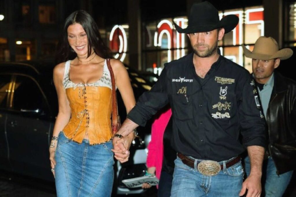 Bella HadiA blushing Bella Hadid made a public appearance in a cowboy outfit with her surprise boyfriend.