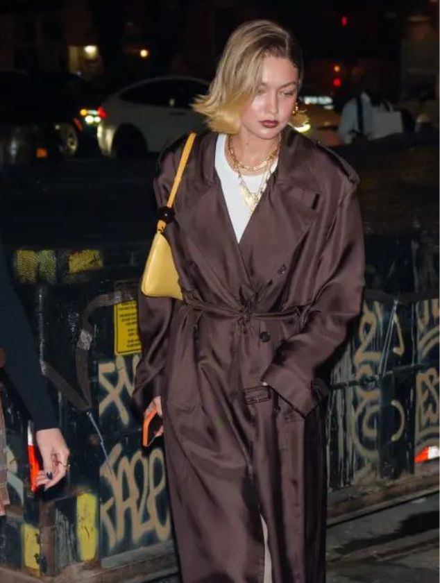 Gigi Hadid Turns Heads in Trench Coat and Gold Accessories on NYC Night Out